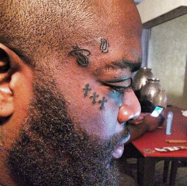 Rick Ross Gets A Miami Heat And Dreamchasers Face Tattoo So We Know It's  Real | Karen Civil